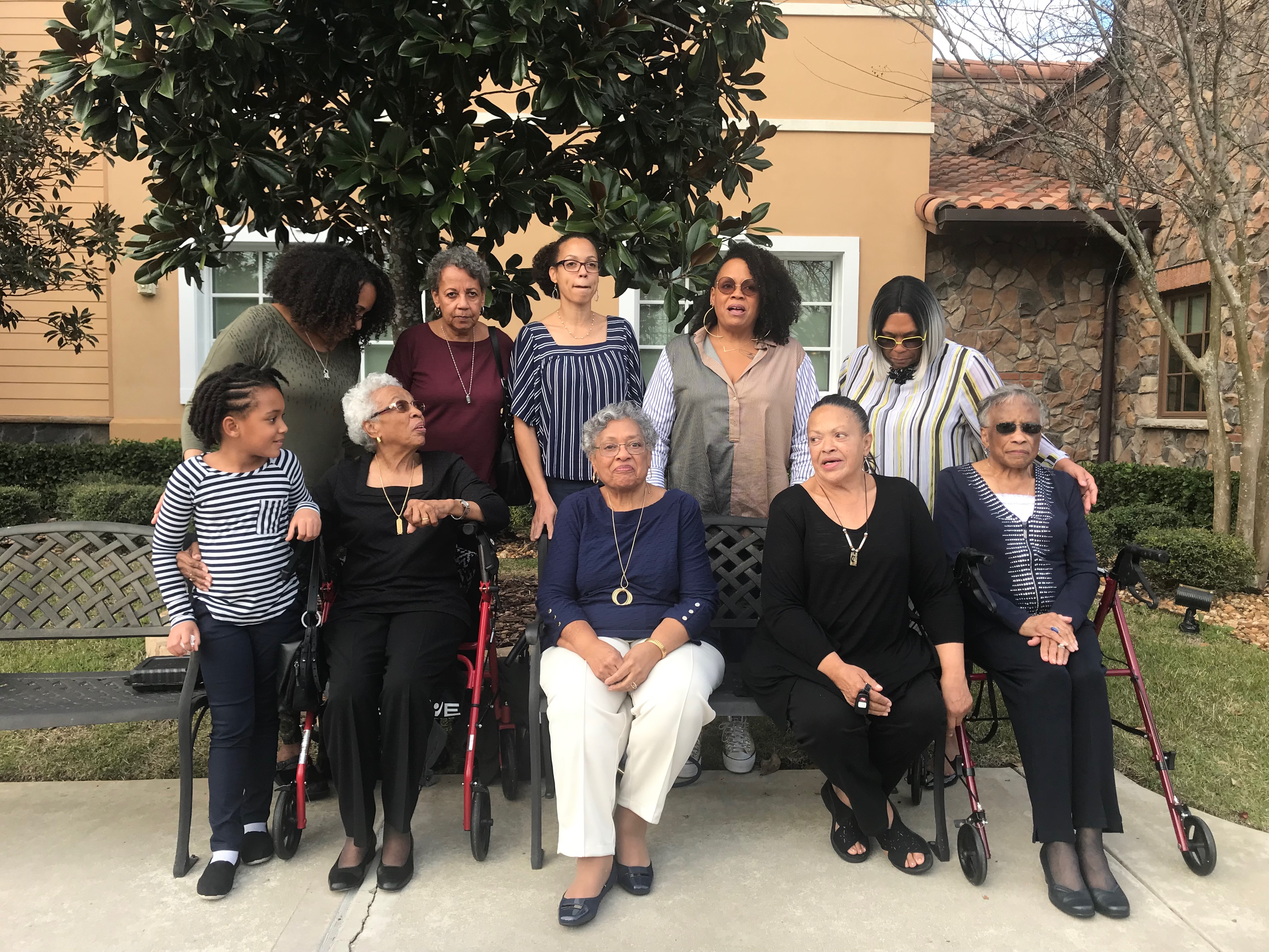 The Warwell Ladies — a multi-generational portrait of women under a magnolia tree